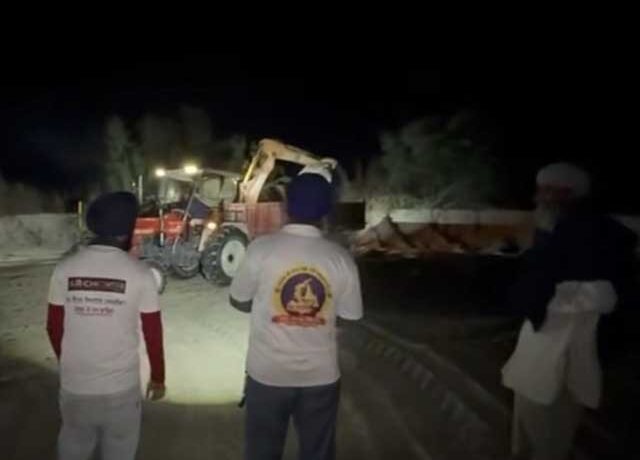 Has Begun Clearing The Field That Was Buried Under Sand Due To Flood-Related Deposits
